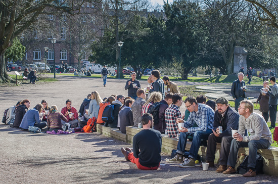 A lot of people are sitting outside.