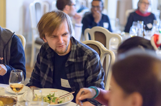 A person is sitting at a table eating lunch.