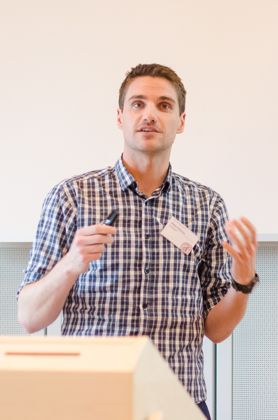 A person is standing behind a podium.