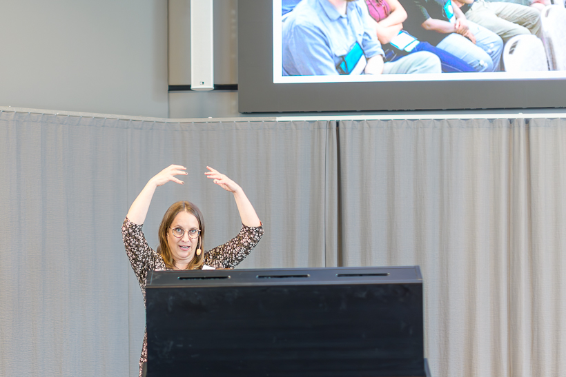 A person is holding their arms above their head. Photo.