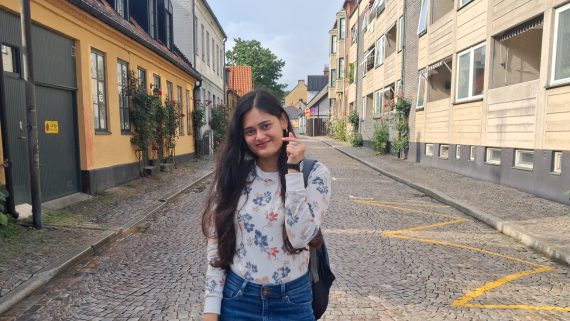 A person is standing in an old town. Photo.