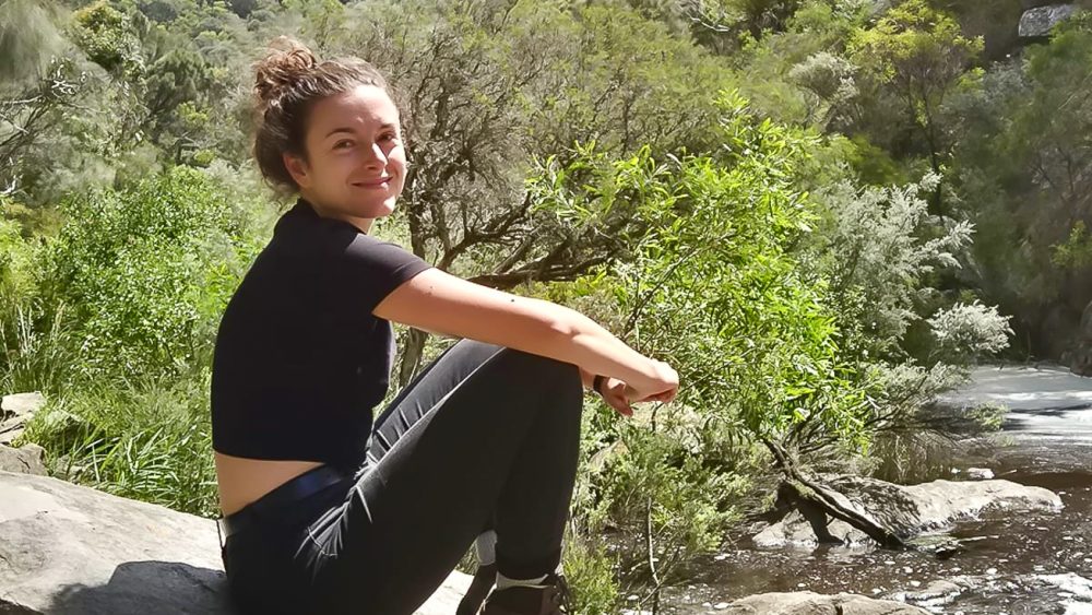 A person is sitting outside. Photo.